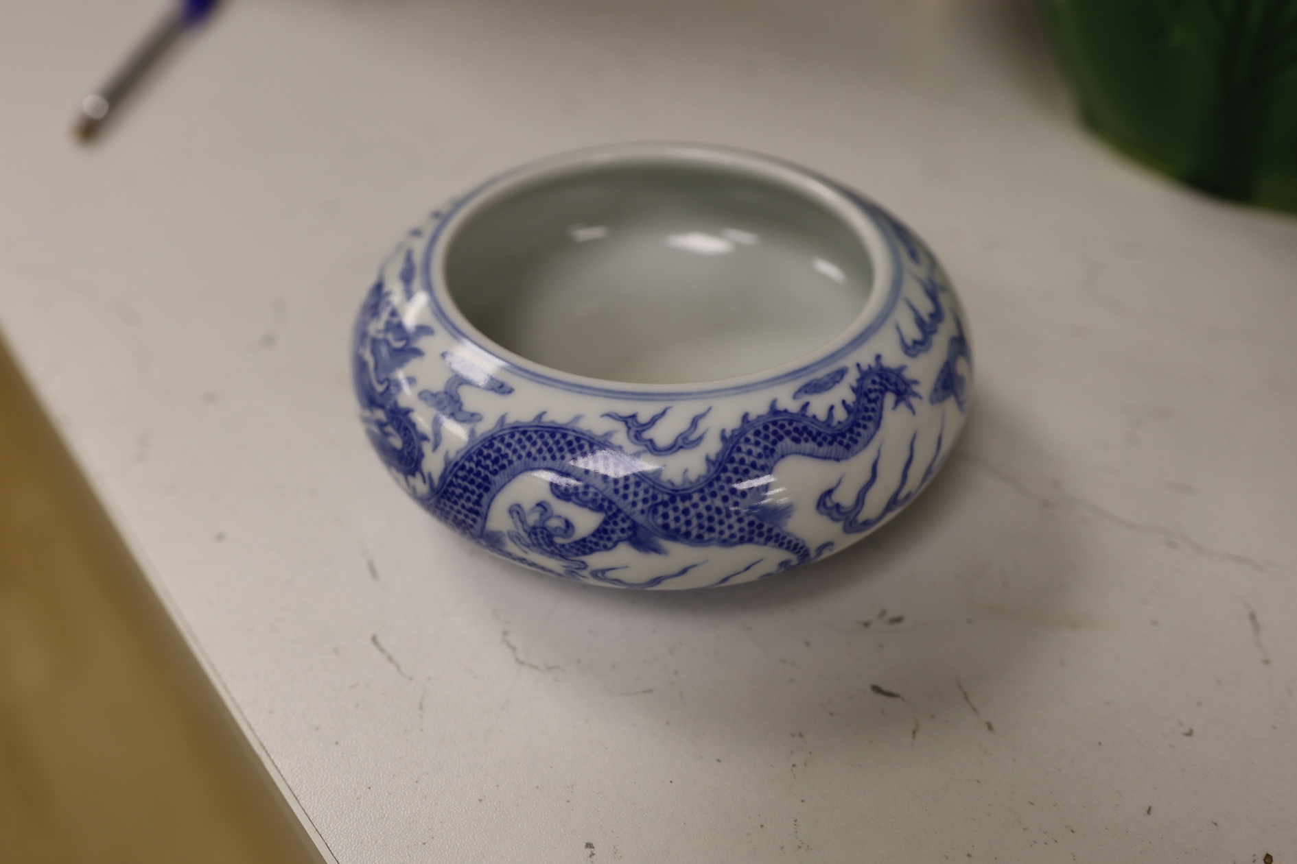 A pair of Chinese enamelled porcelain bowls, an eggshell bowl and a blue and white dragon bowl, turquoise bowls 11cm diameter (4). Condition - fair